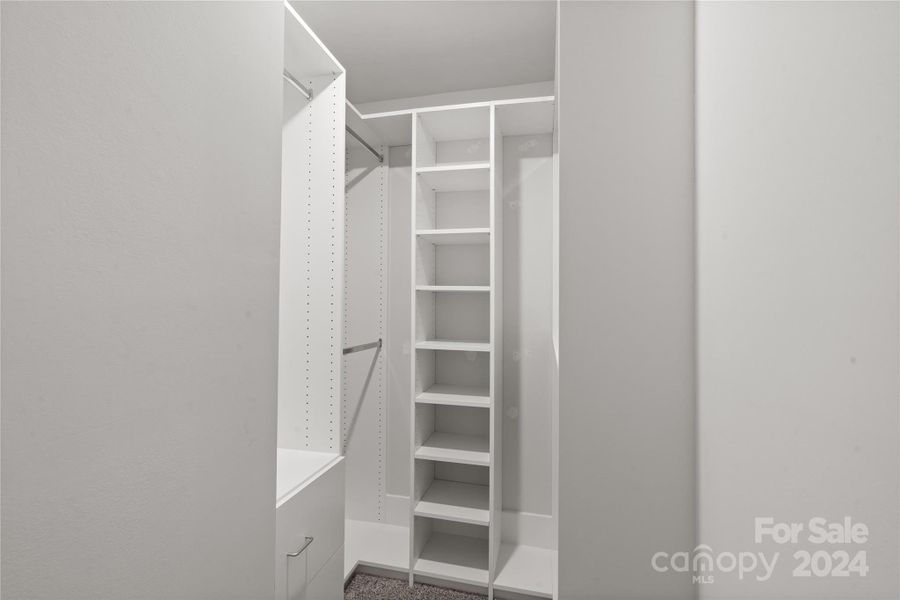 Primary closet with upgraded shelving/closet system