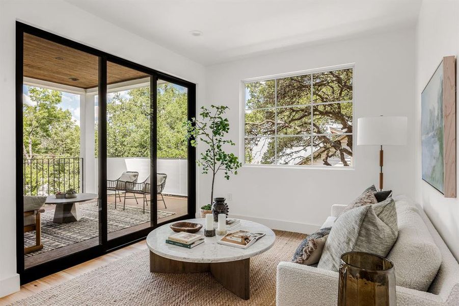 Second level living space with adjoining balcony that features composite decking for longevity.