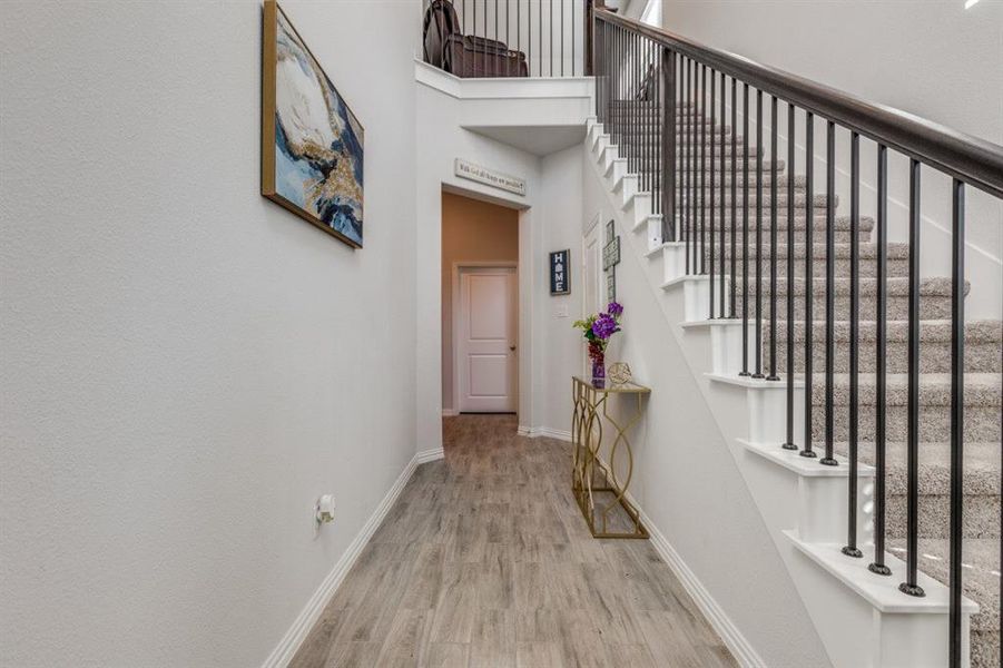 Hall featuring light hardwood / wood-style flooring