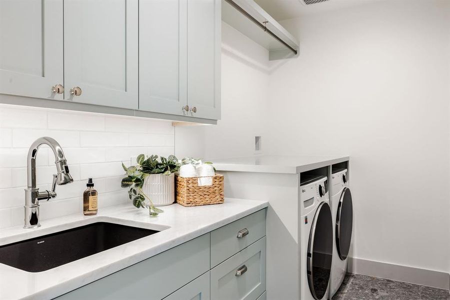 Utility room comes complete with smart LG front load washer and dryer.