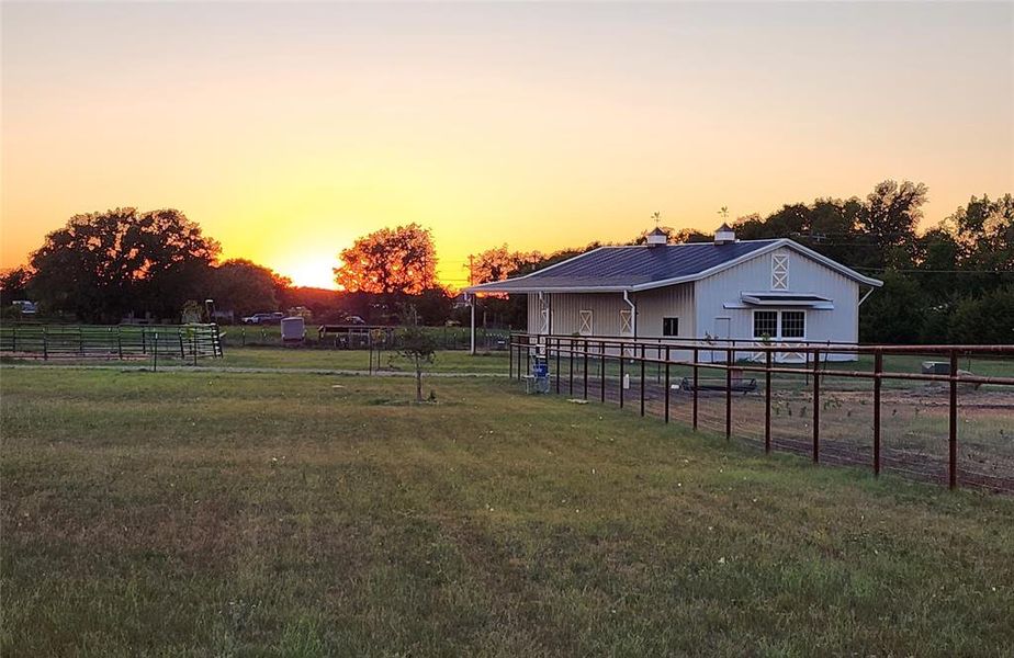 Yard at dusk with a rural view