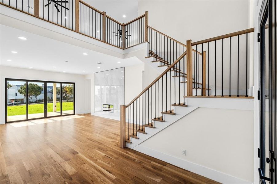 Entryway with a high ceiling and hardwood / wood-style floors