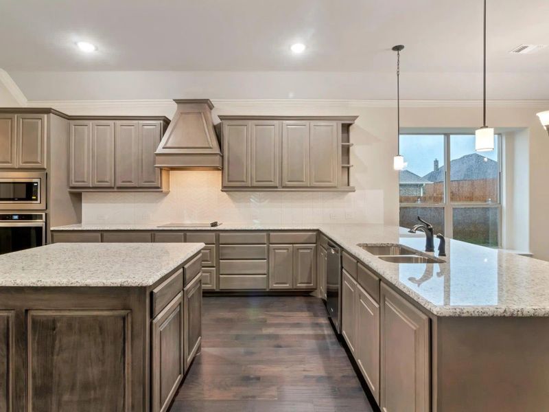 Kitchen | Concept 2533 at Abe's Landing in Granbury, TX by Landsea Homes