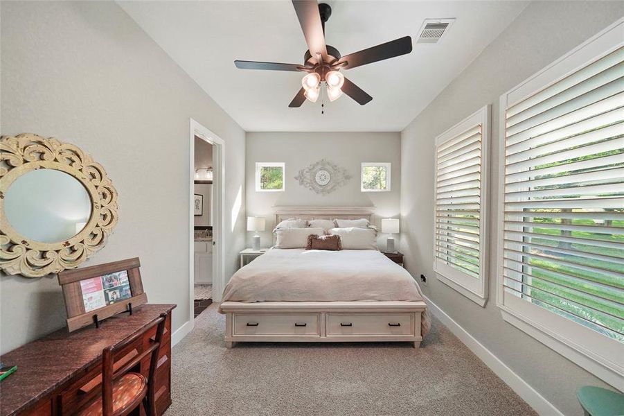 This amazing floor plan provides three first-floor suites and another guest bedroom upstairs. All of these guest bedrooms offer neutral carpet and paint, cooling fans, wood shutters on the windows, large closets and easy or ensuite access to a full bathroom.