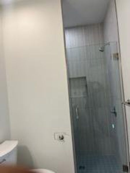 Bathroom featuring toilet and walk in shower