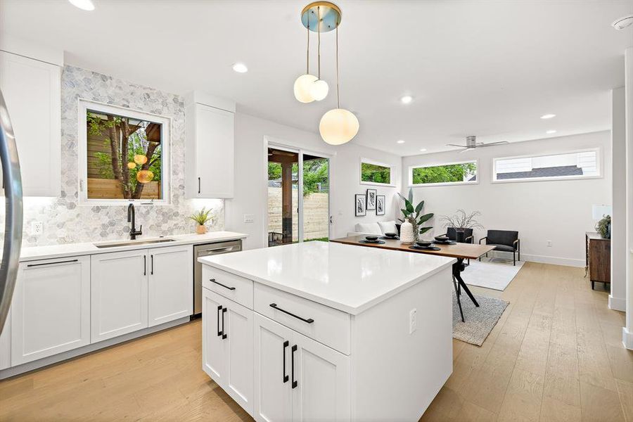 Another view of the island with a huge casement window over the sink.