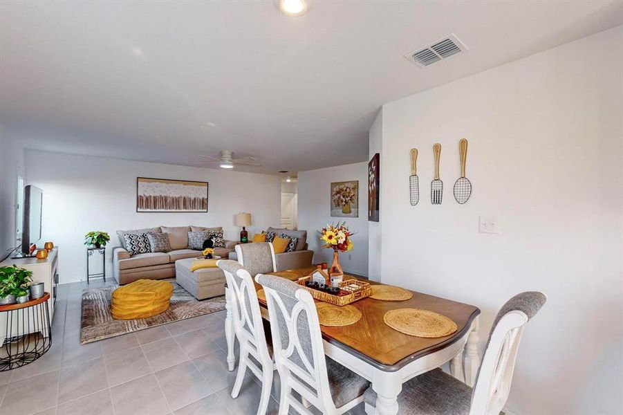 Tiled dining area with ceiling fan