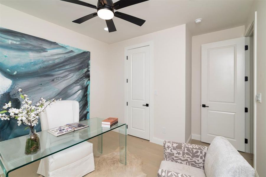 Office featuring ceiling fan and light hardwood / wood-style floors