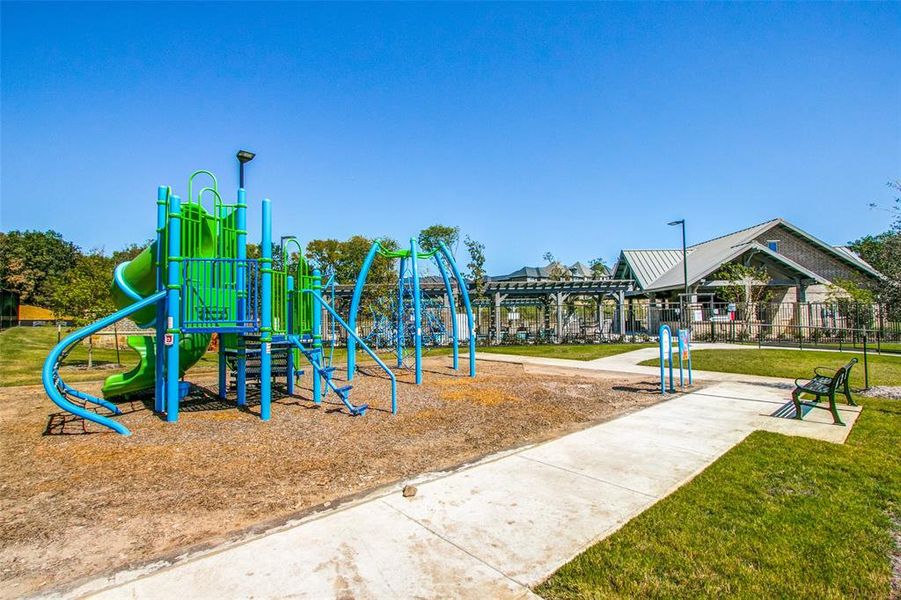 View of playground with a lawn