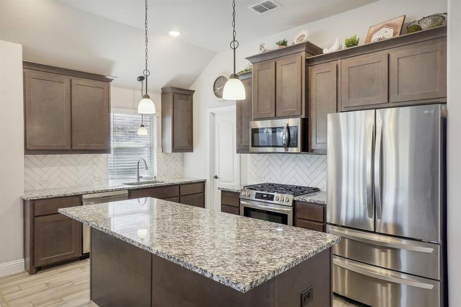 Kitchen with granite countertops & stainless steel appliances