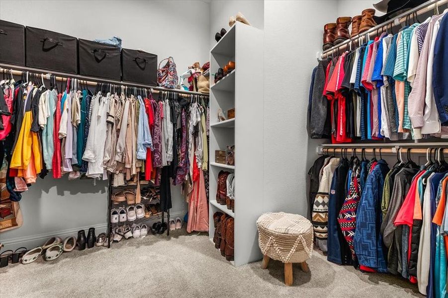 Spacious closet with carpet floors