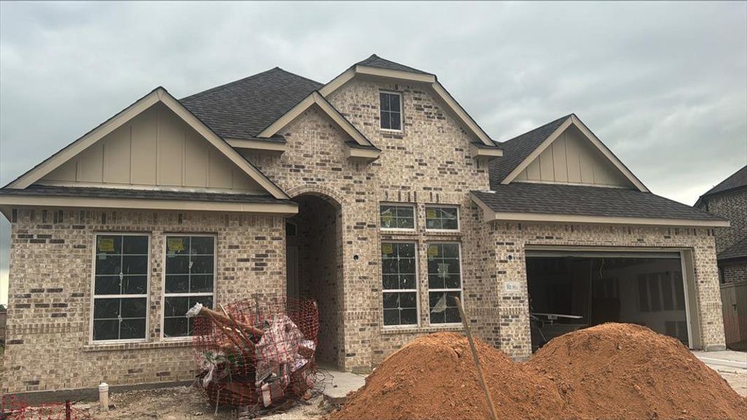 One-story home with 4 bedrooms, 3.5 baths and 3 car tandem garage