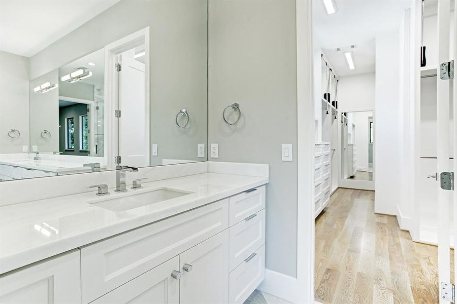 Large counters with great mirrors and lots of storage cabinets and drawer space.