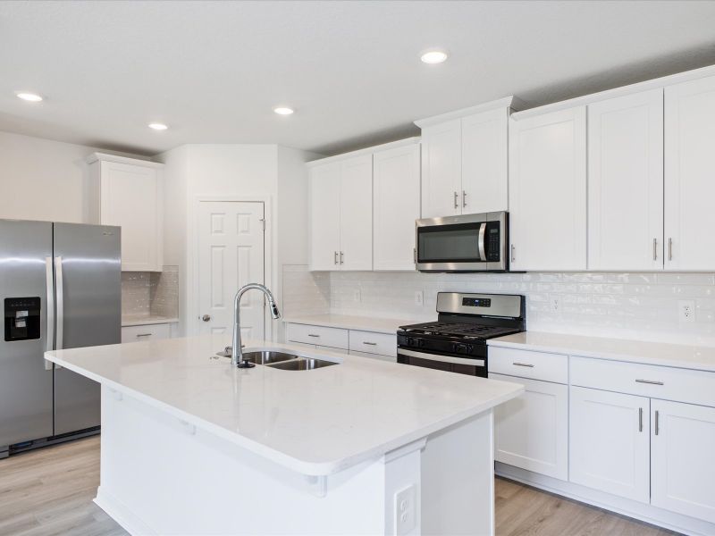 Kitchen in the Foxglove floorplan at 5166 Minneola Lane