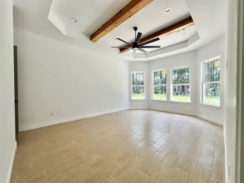 GRAND MASTER BEDROOM WITH CEDAR BEAMS.