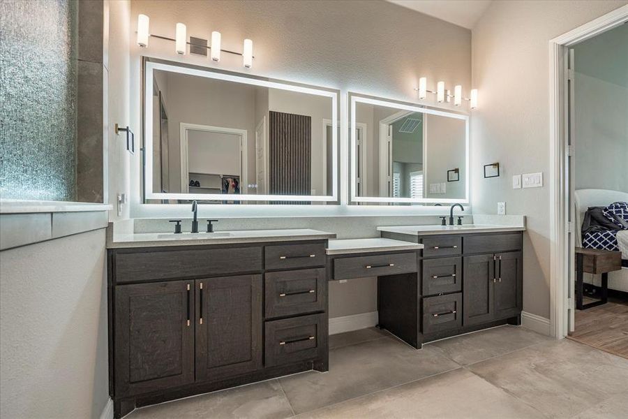 Bathroom featuring dual vanity and tile patterned flooring