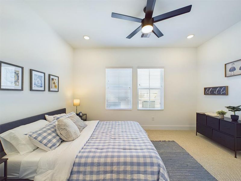 Spacious secondary bedroom with ensuite on the third floor. Photos from another community by the same builder, FINISHES & COLORS MAY VARY! Ceiling fans are not included!