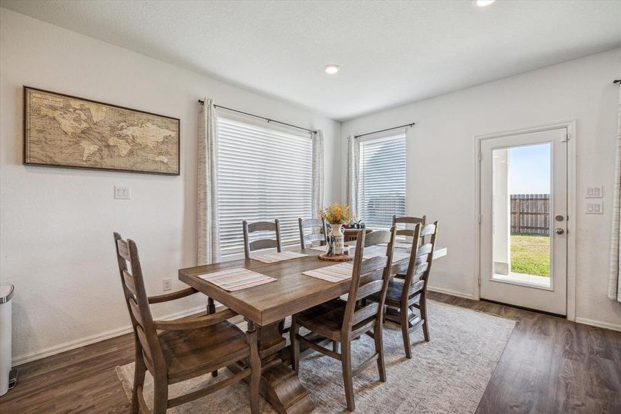 Expansive dining area designed to accommodate a large 6-seat table, offering ample space for dinners, entertaining guests, and special occasions. A perfect spot for creating lasting memories in your new home.