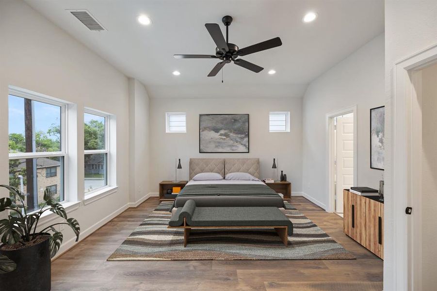 *Virtually Staged*Discover the serene retreat of this spacious primary bedroom, designed with high ceilings and extensive windows that allow for abundant natural light.