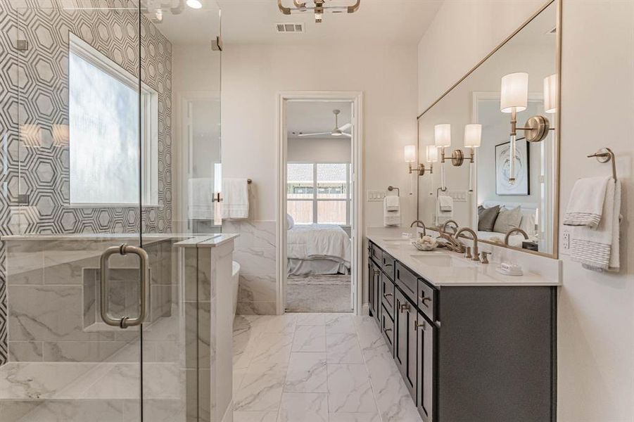 Bathroom featuring walk in shower, ceiling fan, tile flooring, and vanity