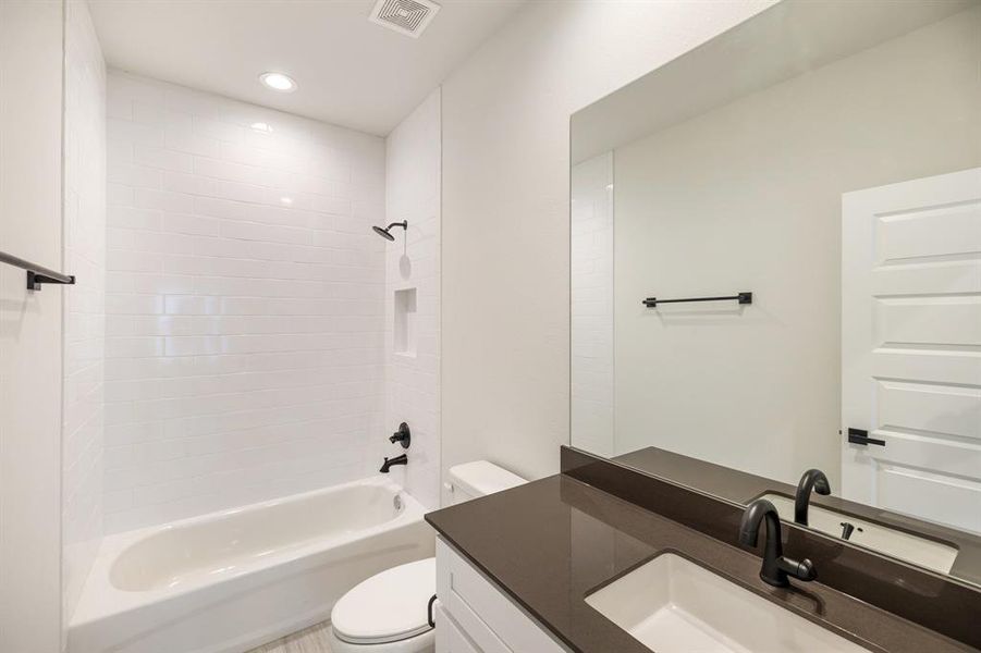 The en suite bathroom is seamlessly integrated into the third-floor secondary bedroom. This arrangement ensures complete privacy and convenience, making it ideal for residents or guests. Each bedroom throughout the home boasts its private bathroom, emphasizing individual comfort and luxury.