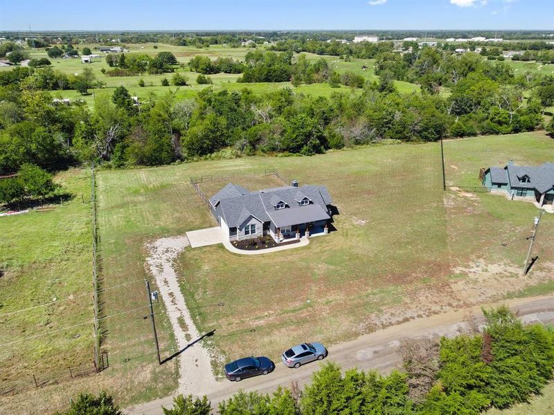 Birds eye view of property featuring a rural view