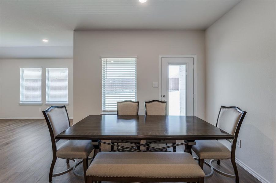 Dining room with a wealth of natural light and hardwood / wood-style flooring