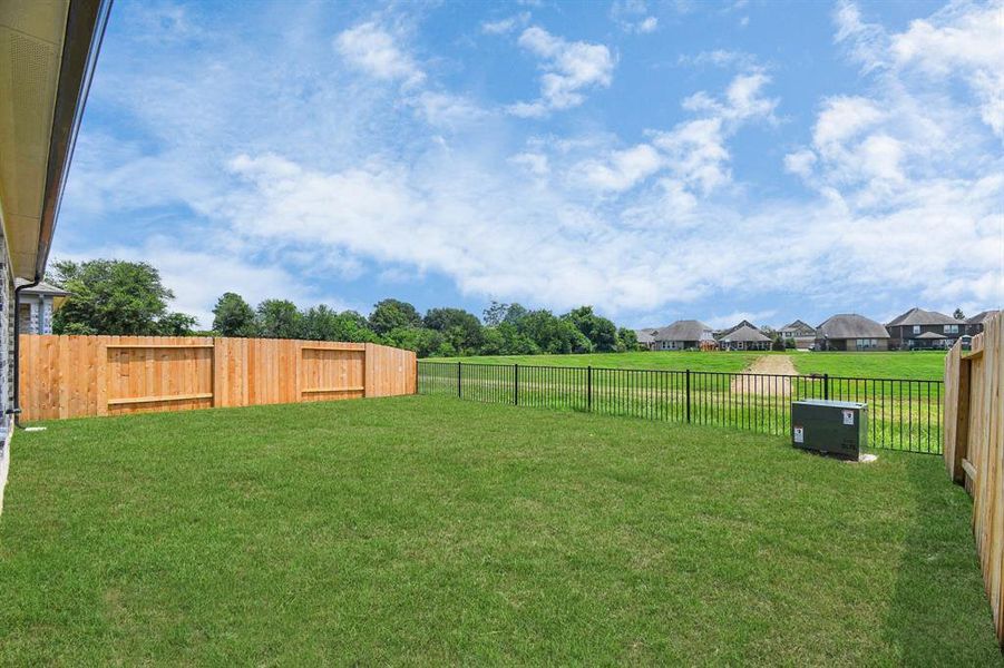 Backyard retreat, offering an abundance of space for kids to play and explore. The possibilities are endless in this open space.