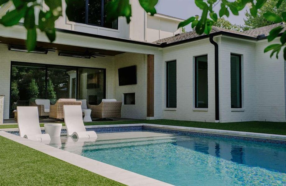 Back of house featuring a patio, ceiling fan, and a yard