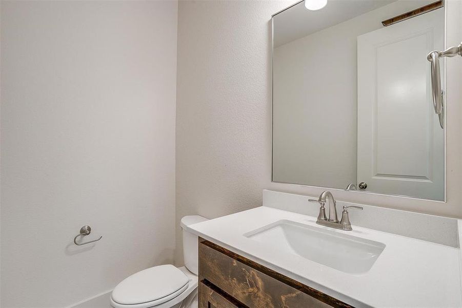 Bathroom with toilet and vanity