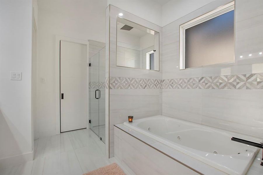 Bathroom featuring separate shower and tub