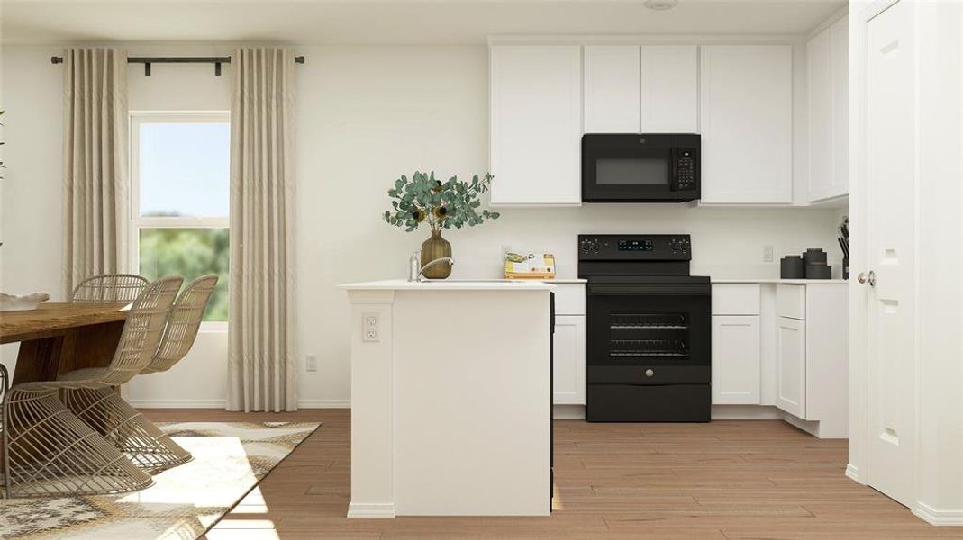 Kitchen featuring white cabinets, electric range, and light wood-type flooring