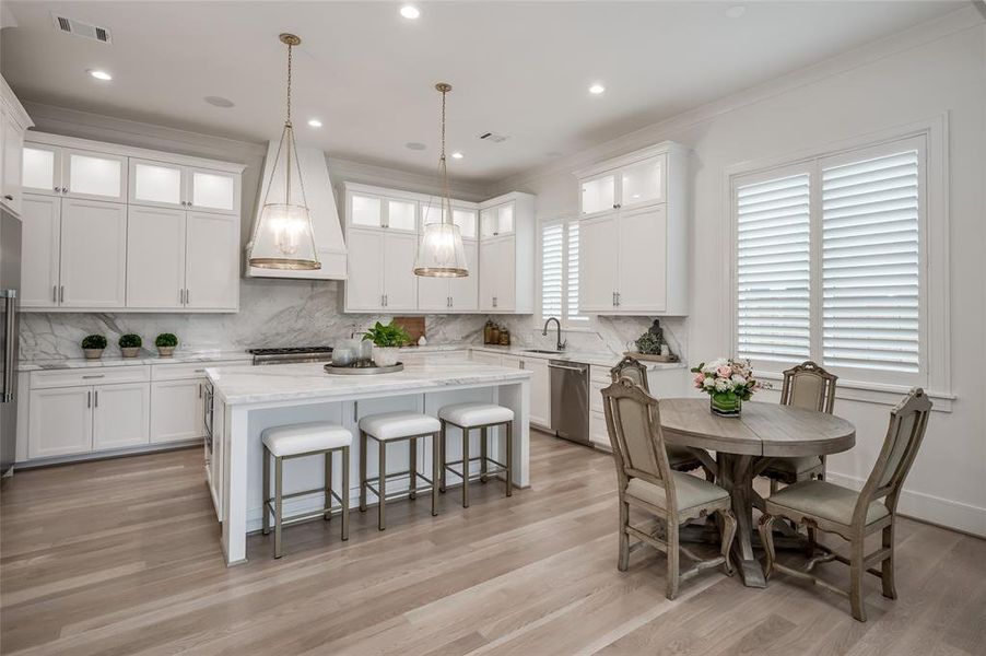 Another angle of the island kitchen featuring a breakfast area.