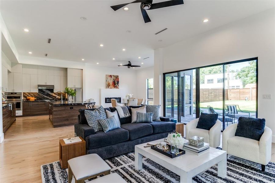 Living room featuring light hardwood / wood-style floors and ceiling fan