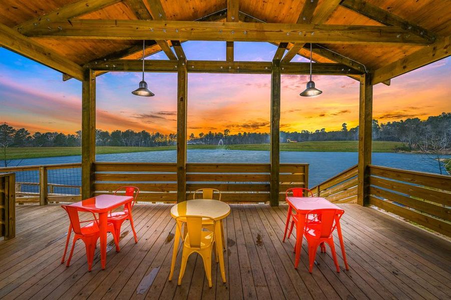 The covered patio is the perfect space to enjoy the sunrise or sunset in Wedgewood Forest.