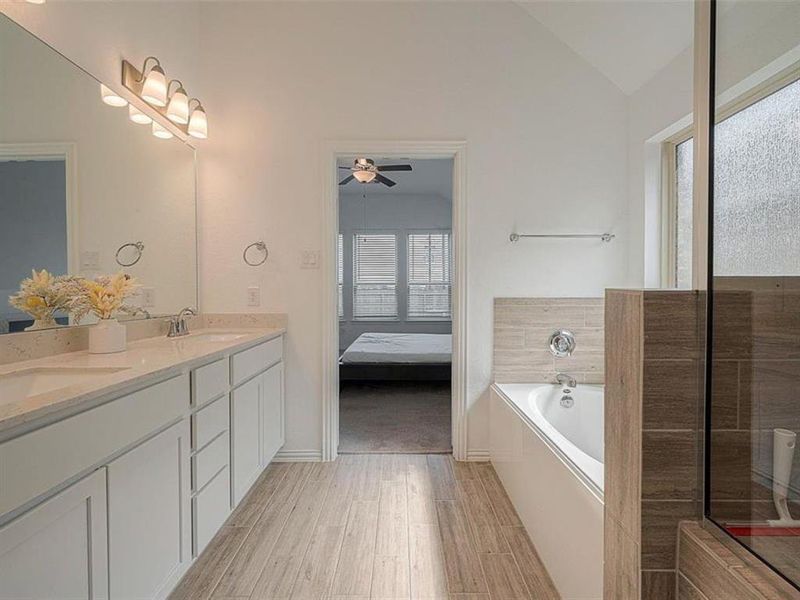 The soaking tub and spacious shower offer a variety of options for relaxation.