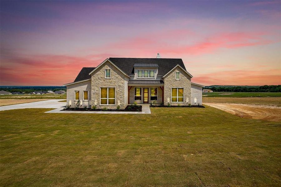 View of front of property with a lawn