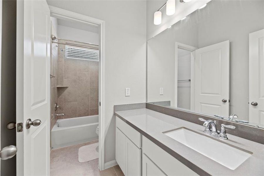 Guest bathroom with a bathtub/shower combination