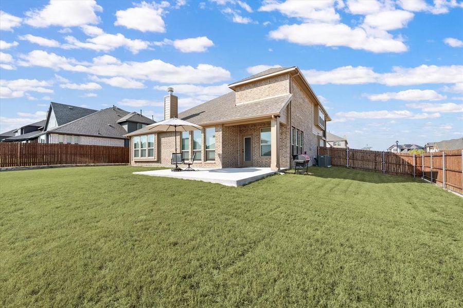 Full sprinkler system. Gutters. Central AC unit located on side of home. Stained fence with steel posts.