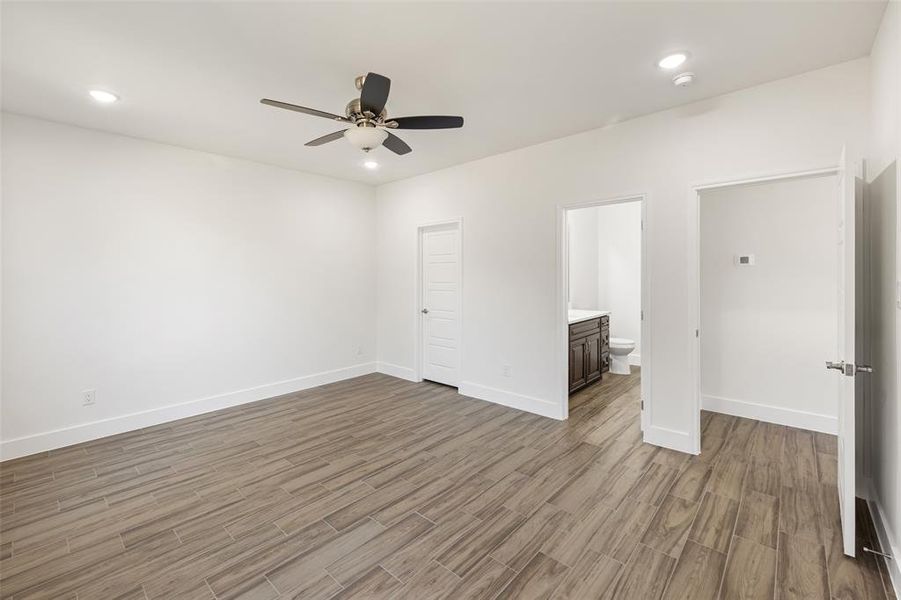 Spare room with ceiling fan and light hardwood / wood-style flooring