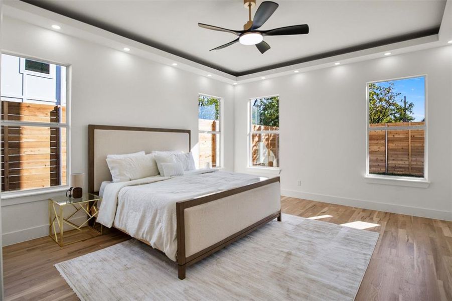 Bedroom featuring ceiling fan and light wood-type flooring