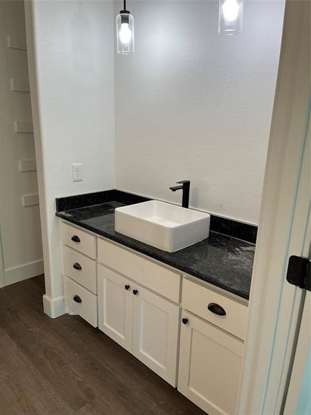 Bathroom featuring vanity and Vinyl plank floors