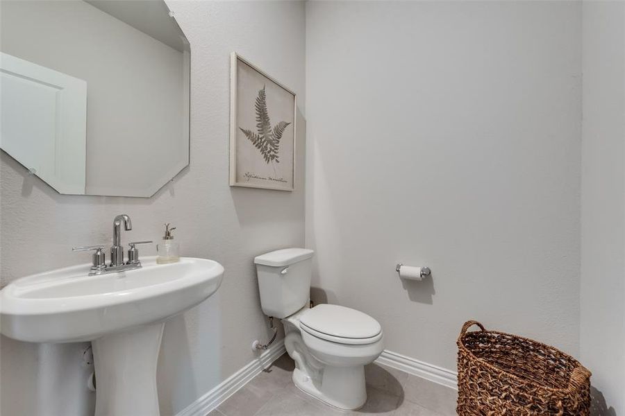 Powder bath with toilet and tile floors