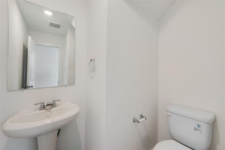 Bathroom featuring sink and toilet