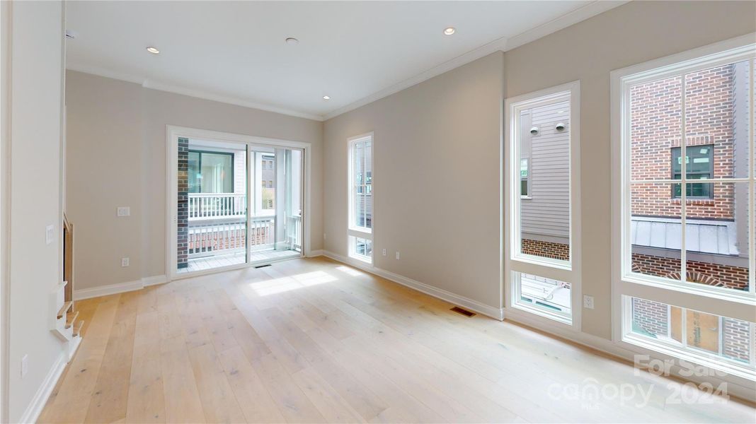 Living Room large glass doors to covered balcony