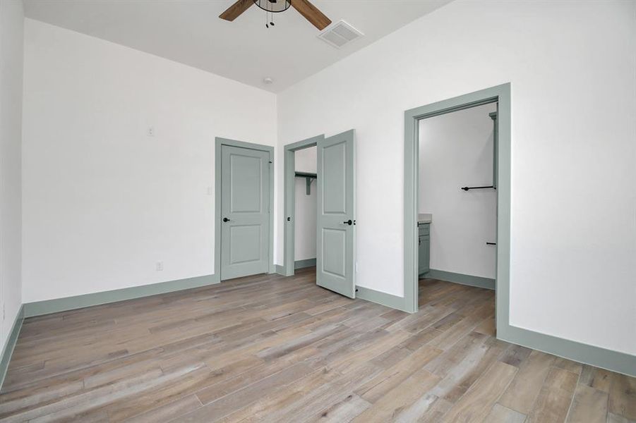 The primary bedroom with TWO spacious closets and an en-suite bath.