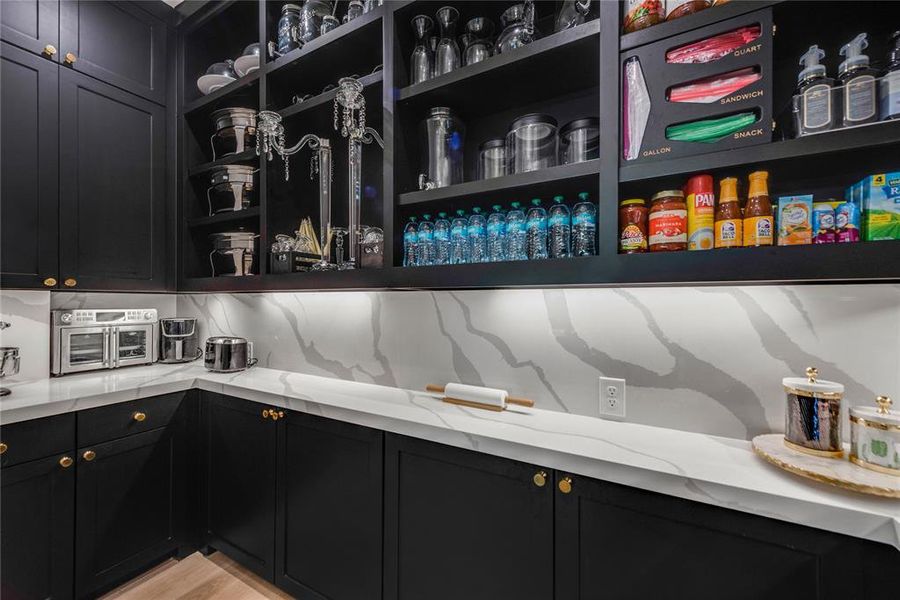 Custom pantry extends beyond this photo