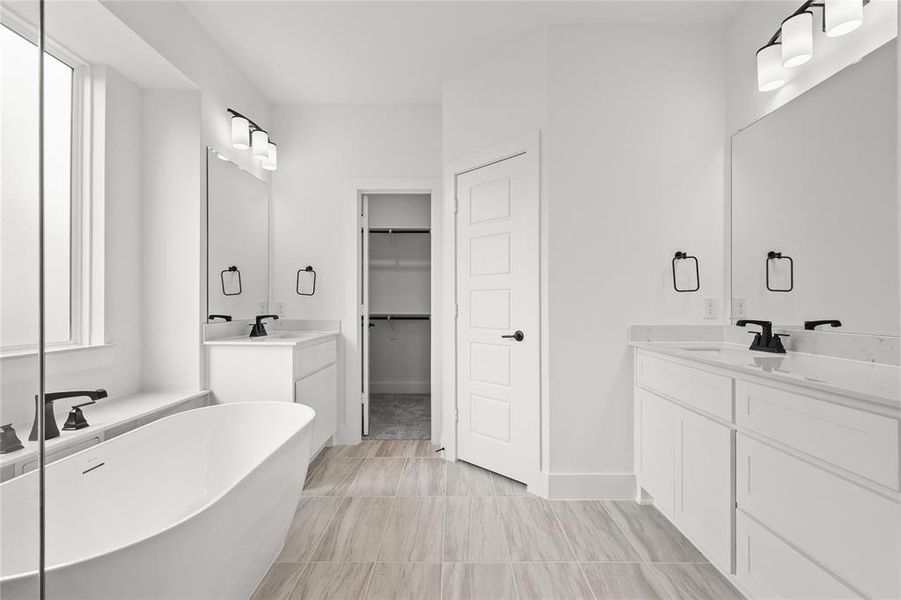 Bathroom featuring vanity and a washtub