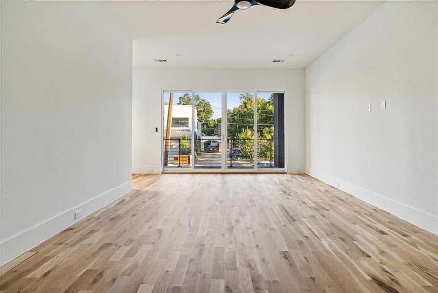 Spare room featuring light hardwood / wood-style floors and ceiling fan