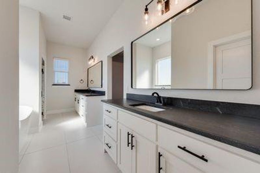 Bathroom with vanity and tile patterned flooring